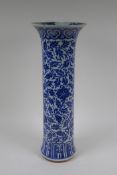 A C19th Chinese blue and white porcelain cylinder vase with allover scrolling floral decoration,