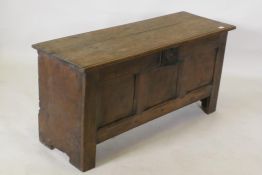 Early C18th oak triple panel oak coffer, with planked top and ends, raised on stile supports, 112