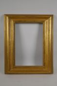 An early C19th giltwood picture frame with bead decoration, 36.5 x 23cm rebate