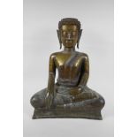 An C18th (?) bronze Buddha, probably Burmese, with historic repairs, 46cm high
