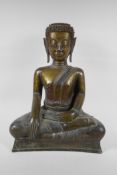 An C18th (?) bronze Buddha, probably Burmese, with historic repairs, 46cm high