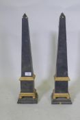 A pair of painted wood and parcel gilt obelisks, 55cm high