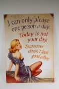 A vintage style metal sign depicting a pin-up with an aphorism, 50 x 70cm