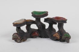 A Chinese cast iron brush rest in the form of Ruyi, set with assorted colored hardstones, 13cm long