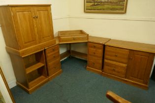 A contemporary solid oak corner office desk with filing cabinets and chest of drawers