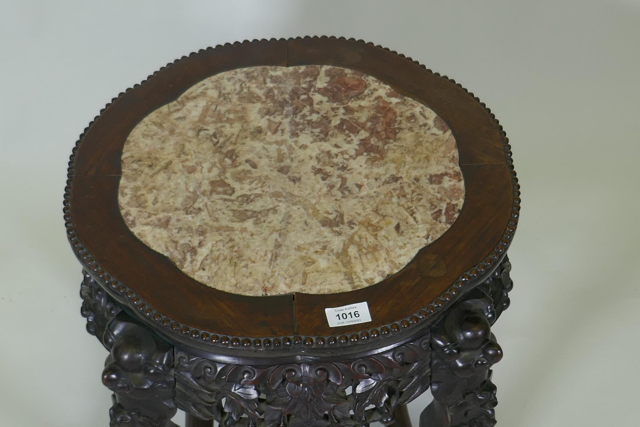 A Chinese hardwood jardiniere stand with shaped top inset with pink marble, with carved and - Image 2 of 3