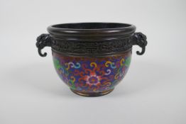 A Chinese bronze pot with cloisonne lotus flower decoration and two dragon mask handles, seal mark