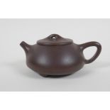 A Chinese YiXing teapot, impressed marks to base, 10cm diameter