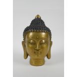 A Chinese filled head bust of Buddha, character mark to base, 22cm high