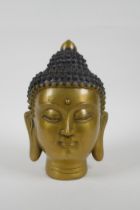 A Chinese filled head bust of Buddha, character mark to base, 22cm high