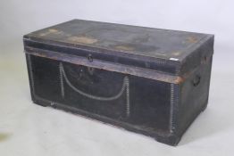 A Georgian travel trunk, with green leather cover and brass stud decoration, original black
