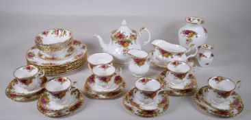 A Royal Albert Old Country Rose six place setting part dinner and tea service, comprising teapot,