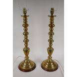 A pair of spun brass table lamps, 57cm high