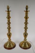 A pair of spun brass table lamps, 57cm high