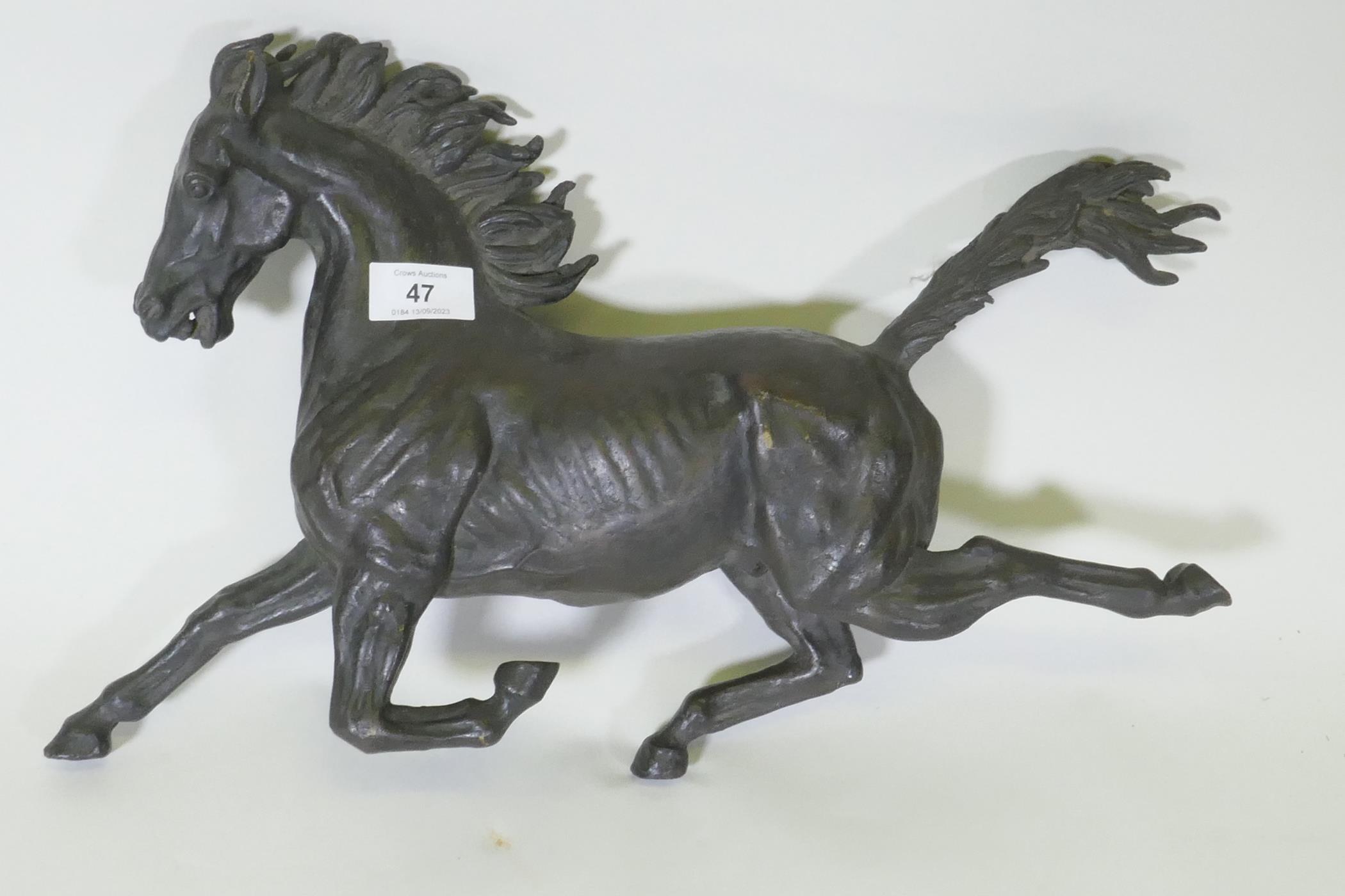 A bronze figure of a galloping horse, unsigned, 40cm long