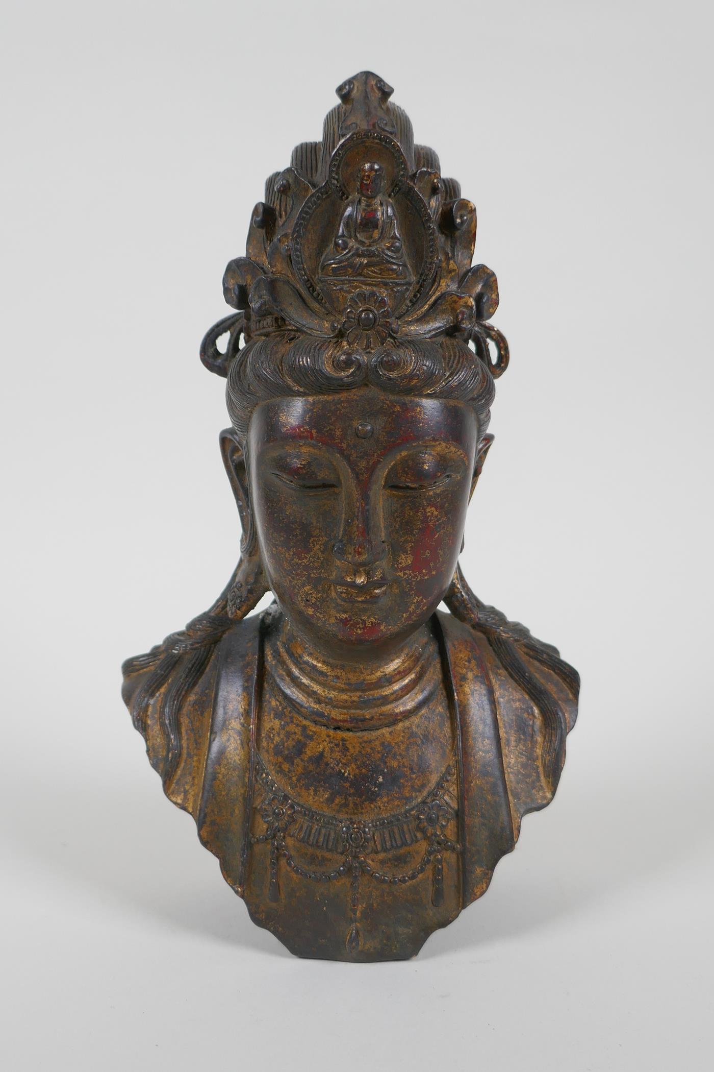 A Chinese filled gilt bronze bust of Quan Yin, 21cm high