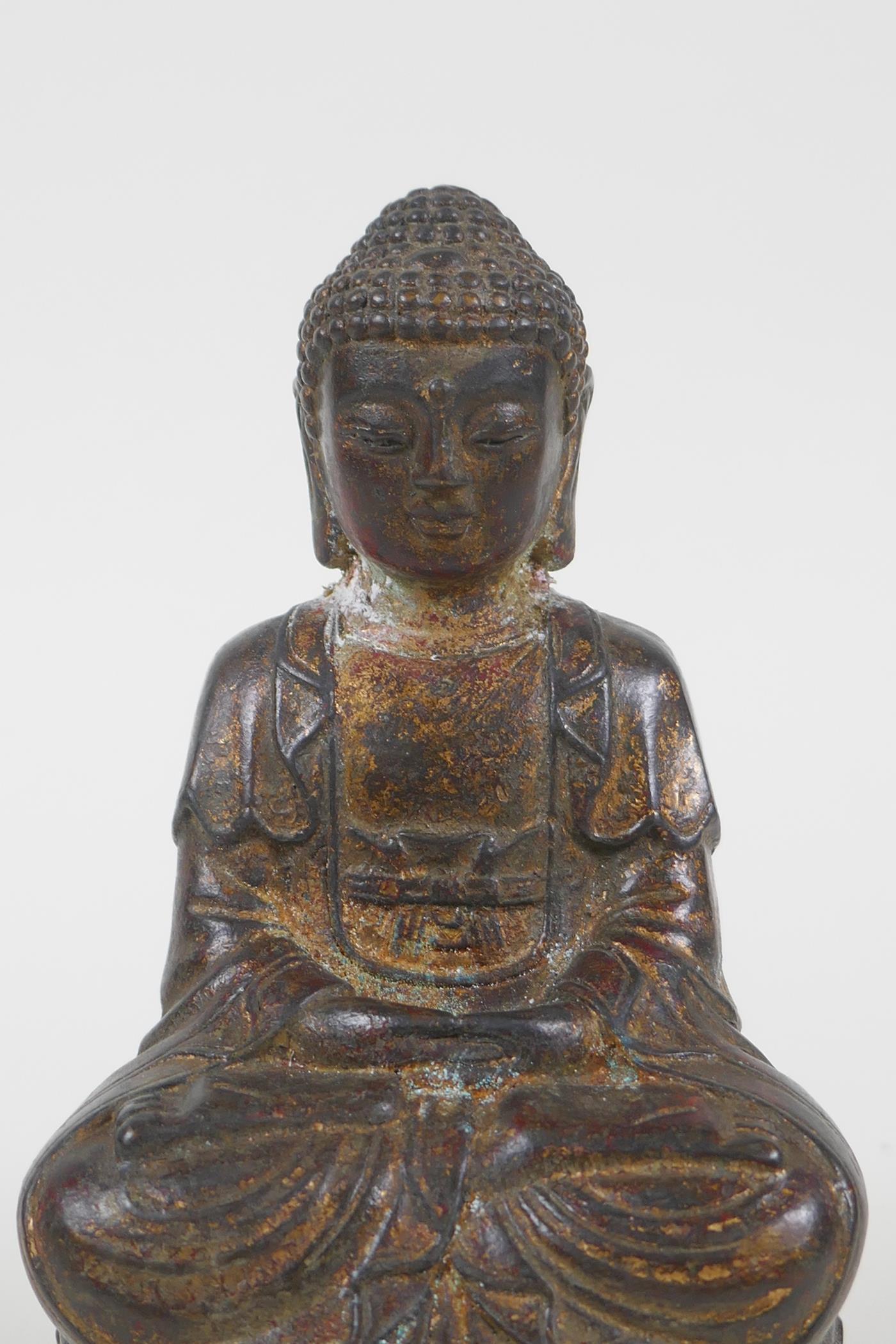 A Chinese filled gilt bronze figure of Buddha, 4 character mark to base, 14cm high - Image 2 of 4