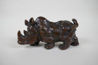 A bronzed metal rhinoceros, filled, 19cm long