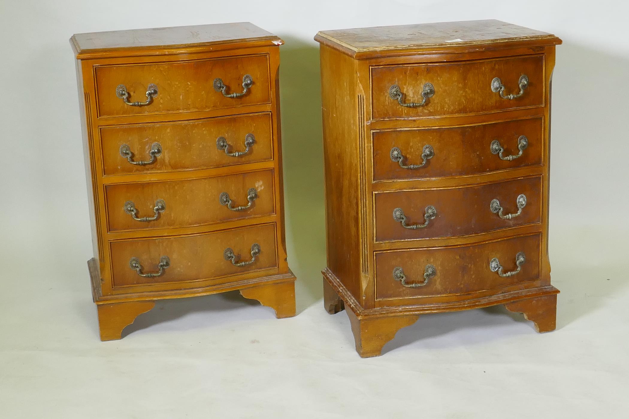 A pair of serpentine front yew wood veneered bedside chests of four drawers with brass handles, - Image 2 of 3