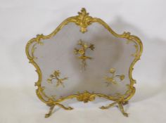 A rococo style brass firescreen with applied floral decoration, 74 x 68cm