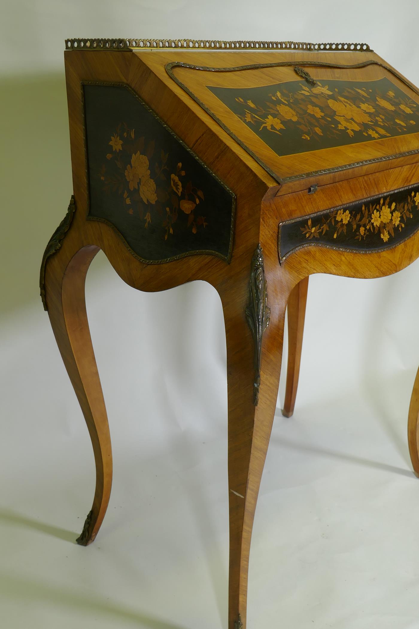 A French marquetry inlaid kingwood bureau-de-dame, with brass mounts, the fall front folding down to - Image 4 of 5