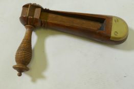 A C19th wood policeman's rattle with brass mounts, 22cm long