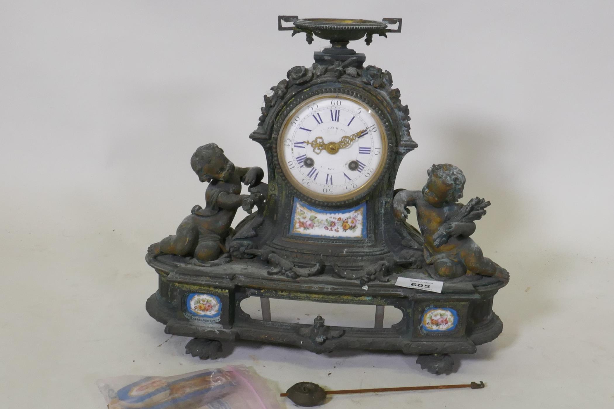 A C19th French Le Roy & Fils gilt bronze mantel clock with Sevres style inset porcelain plaques, the