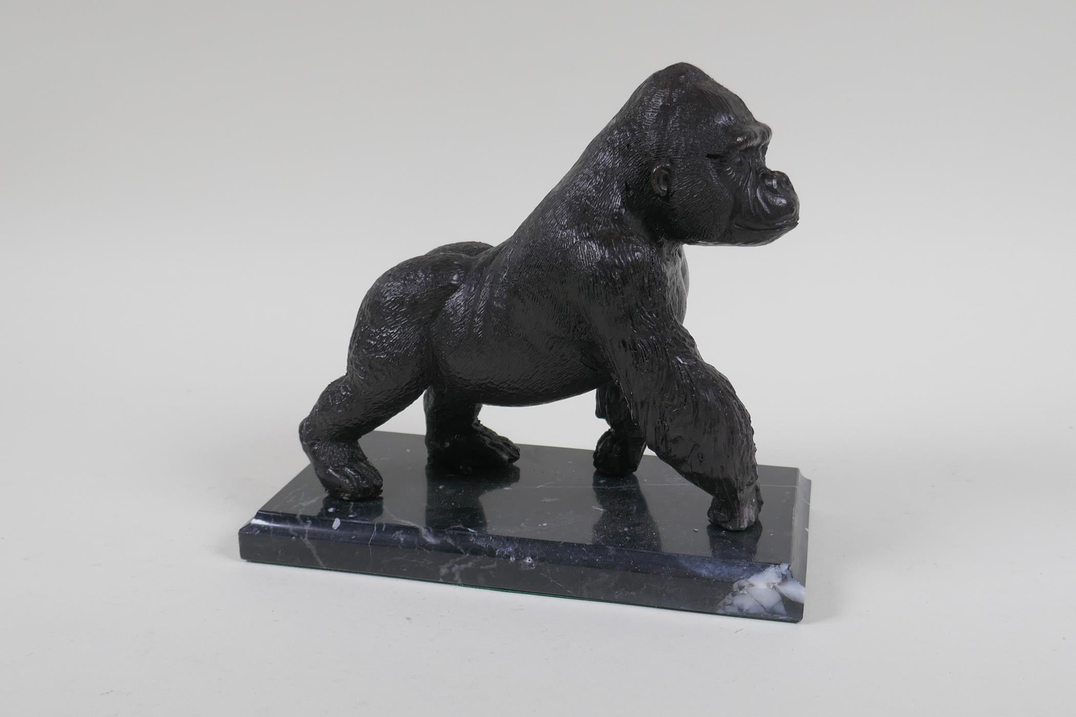 A cast bronzed metal gorilla, mounted on a marble base, 18cm high - Image 3 of 3