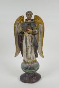 A C19th carved and painted limewood figure of a saint, AF repair, 35cm high