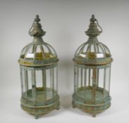 A pair of domed topped metal lanterns with distressed gilt and ver de gris patina, 60cm high