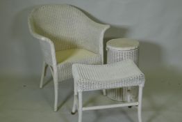 A Lloyd Loom chair, bin and stool