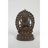 A Tibetan gilt bronze figure of a wrathful deity, impressed double vajra mark to base, 17cm high