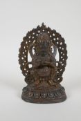 A Tibetan gilt bronze figure of a wrathful deity, impressed double vajra mark to base, 17cm high