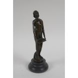 An Art Nouveau style bronze figure of a woman carrying a tray, 19cm high