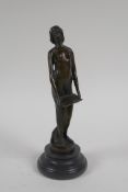 An Art Nouveau style bronze figure of a woman carrying a tray, 19cm high