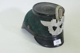 A WWII German Third Reich policeman's shako, labelled inside 'Erel' Tschako, Hans Romer, lacks