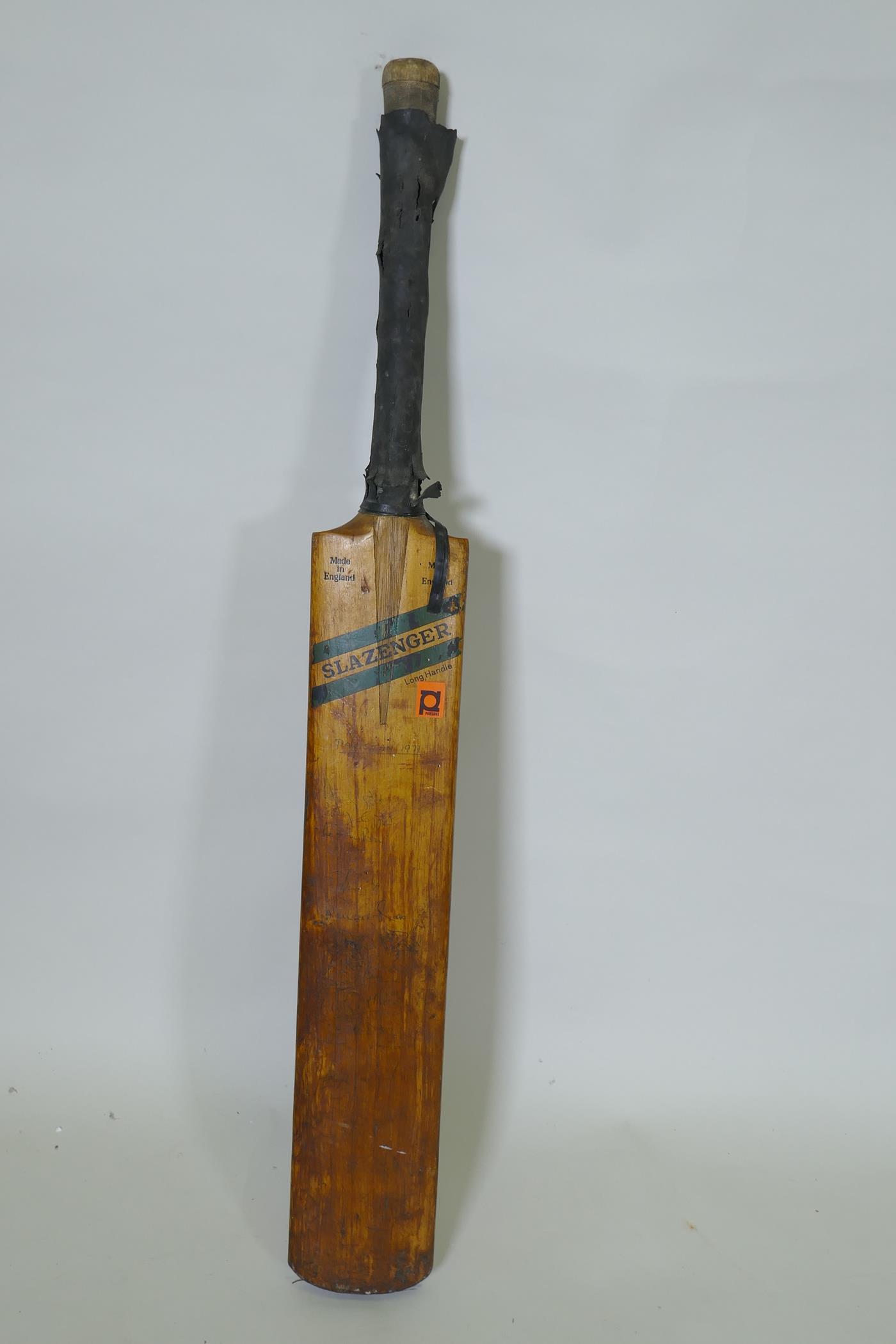 A Slazenger cricket bat, signed with players autographs, Pakistan 1971, Derbyshire, Surrey,