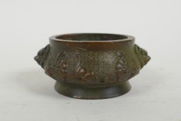 A Chinese bronze censer with two lion mask handles and raised bat decoration, Qianlong 4 character