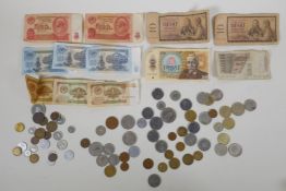 A quantity of vintage world coinage and bank notes, including pre-Euro