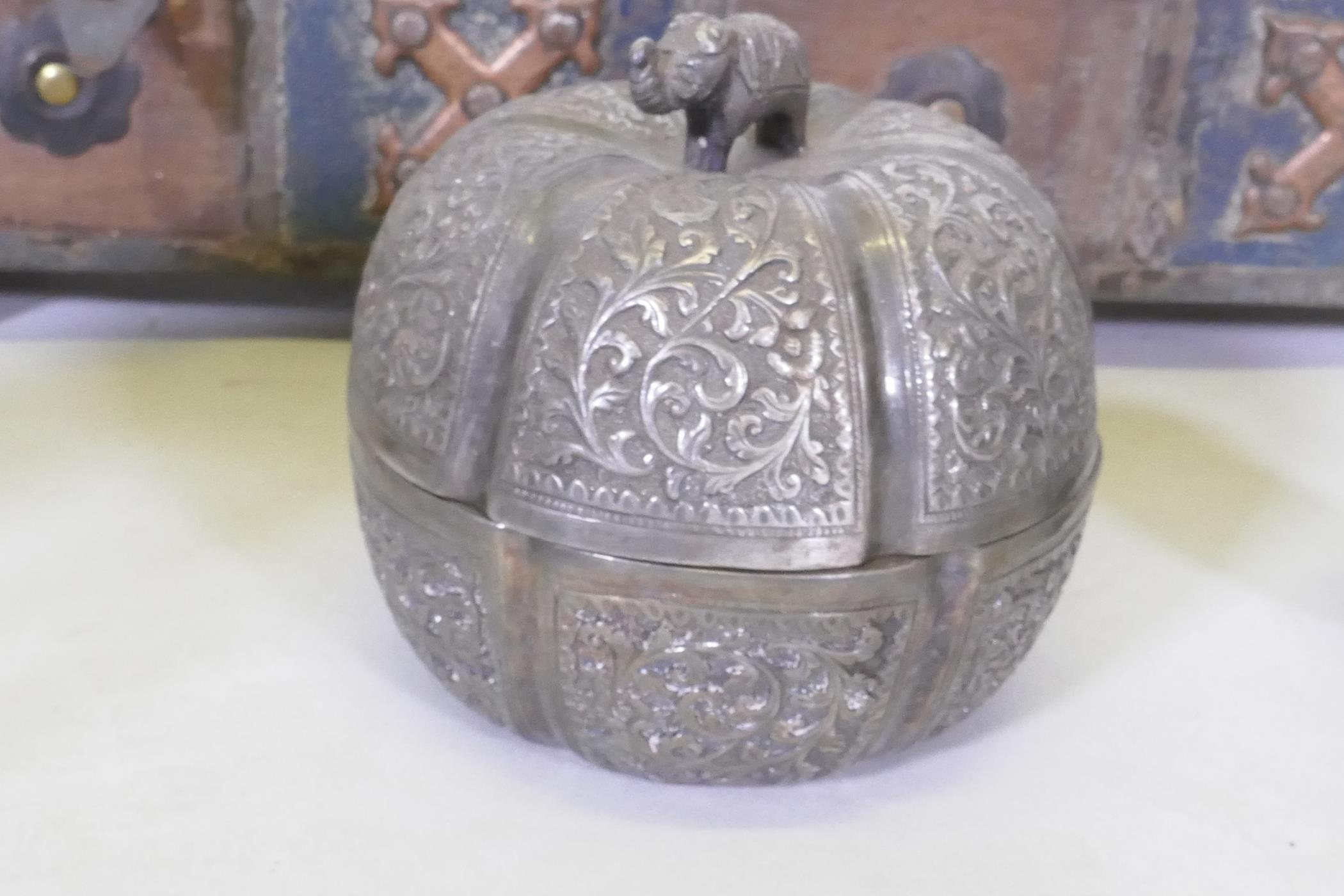 An Indian wood and metal mounted candle box, white metal pot and cover, a pair of bronzed metal - Image 5 of 5