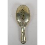 An antique Irish silver plated clothes brush, decorated with inlaid moss agate in the form of clover