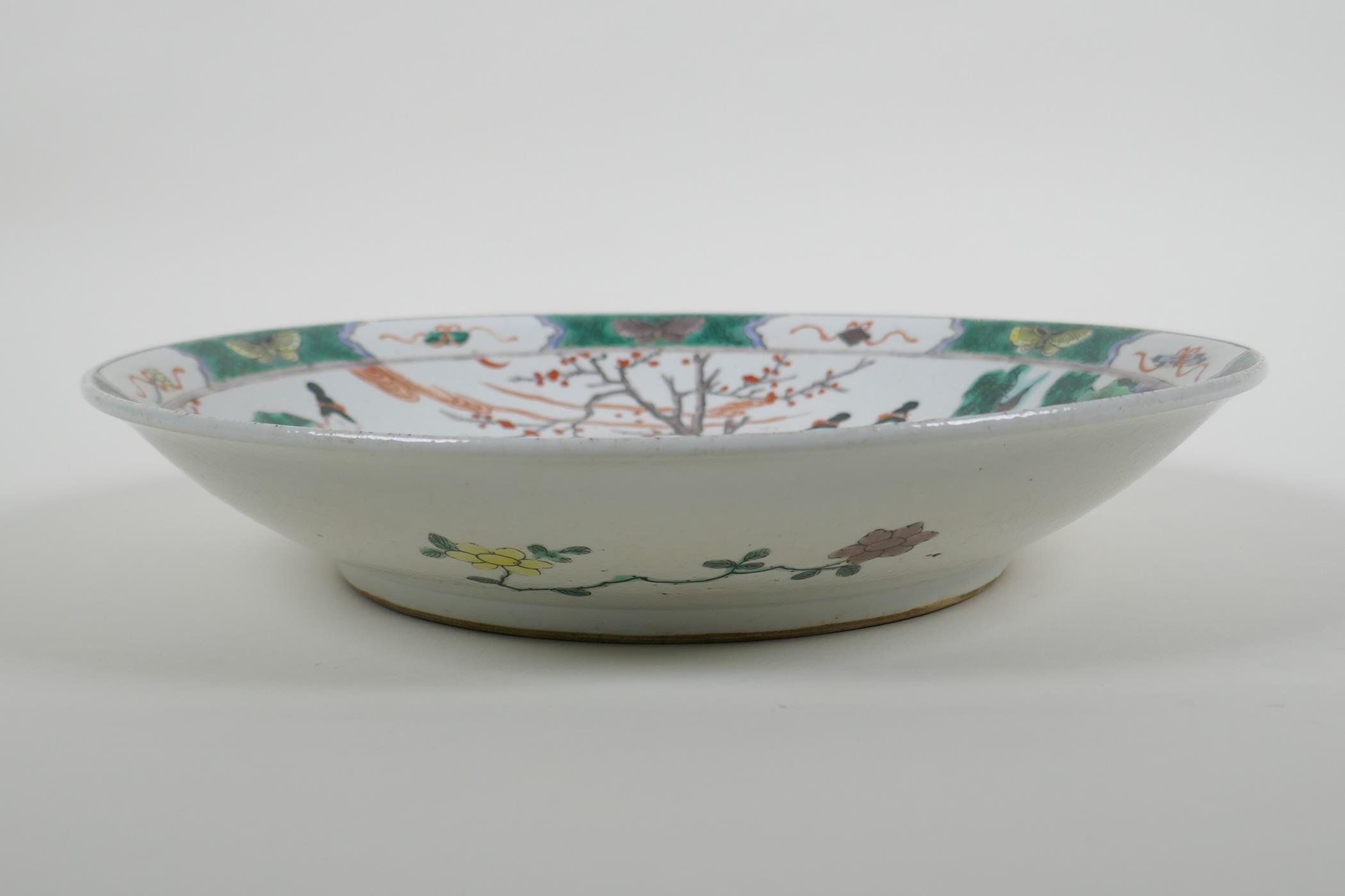 A Chinese KangXi style famille verte porcelain charger decorated with women in a landscape, vase - Image 3 of 5