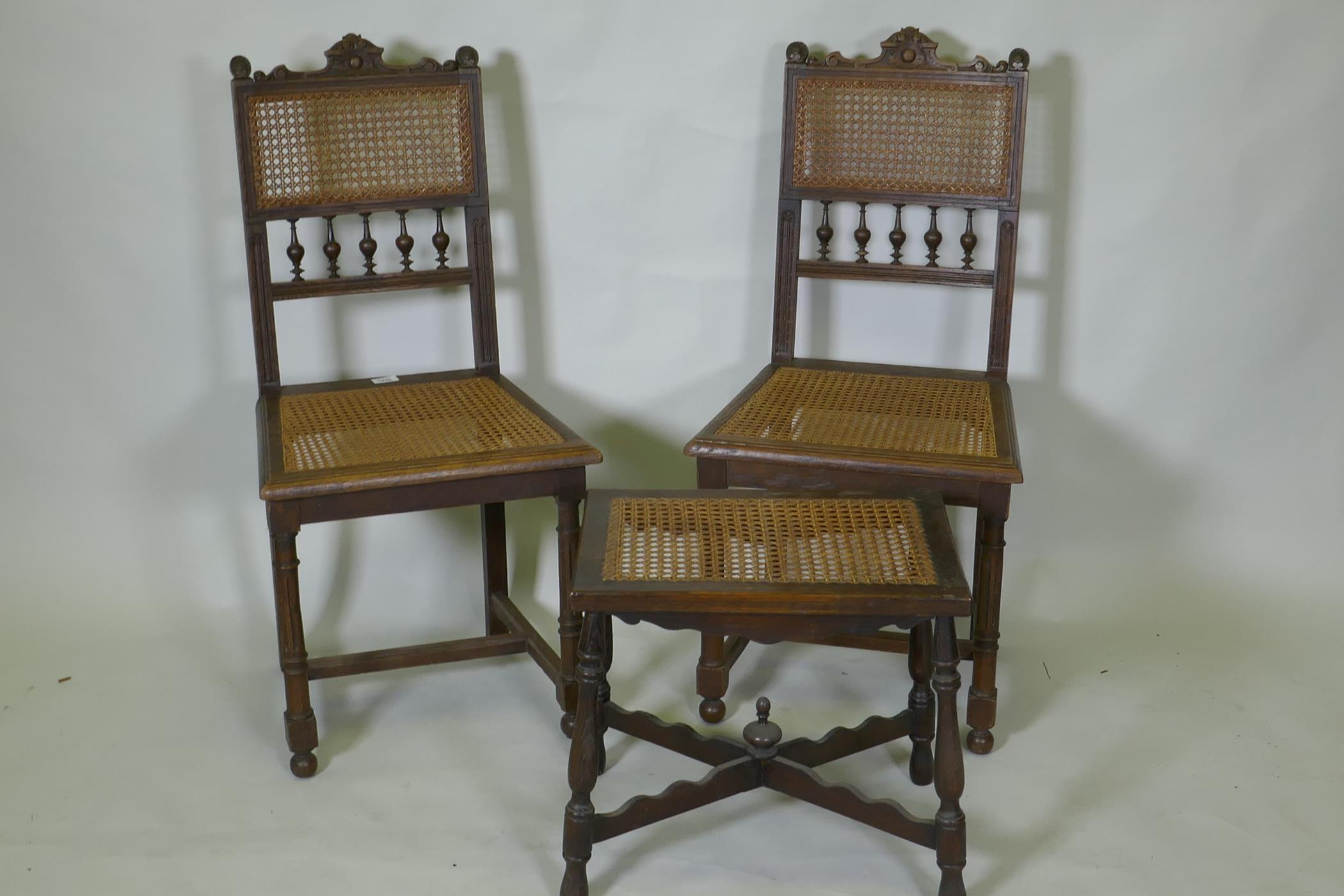 A pair of C19th French oak side chairs with cane seats and backs, and a stool