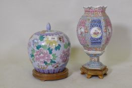 A vintage Chinese porcelain lamp with pierced sleeve and polychrome decoration, and a jar and cover