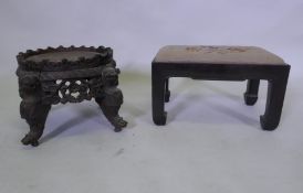 A C19th oriental hardwood stand, with carved and pierced frieze, raised on dragon supports, possibly