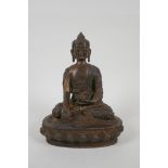 A Tibetan gilt bronze figure of Buddha seated in meditation, impressed double vajra mark to base,
