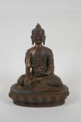 A Tibetan gilt bronze figure of Buddha seated in meditation, impressed double vajra mark to base,