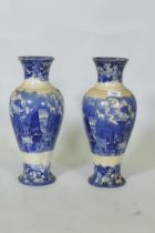 Pair of Wedgwood Etruria 'Ferrara' blue and white vases, impressed and stamped to base, 38cm high