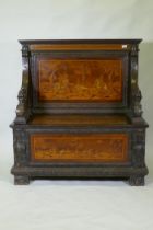 An early C19th Continental marquetry inlaid settle, the seat back and front panel decorated with