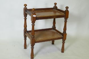 A small Victorian mahogany two tier buffet, with galleried top, raised on turned supports, 40 x 60 x